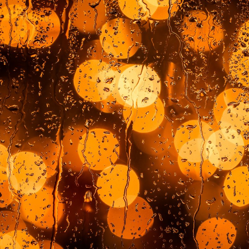 lights behind wet glass