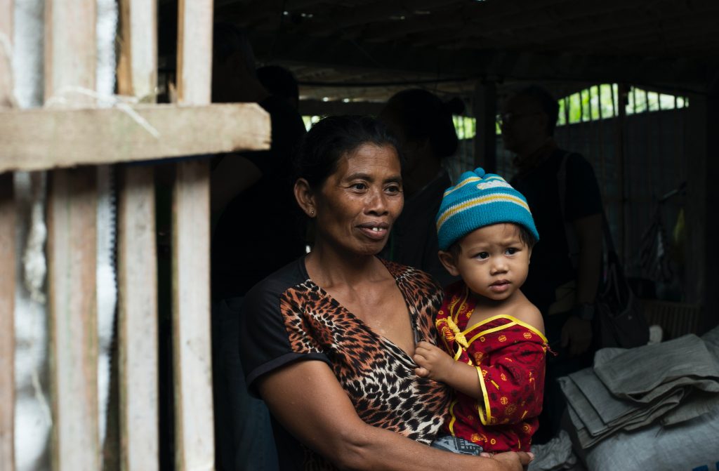 women carrying child